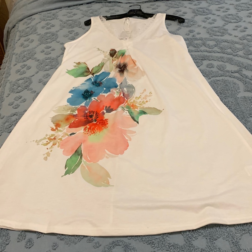 Floral design front/back.  Size misleading, more like Med/Large. Beautiful dress